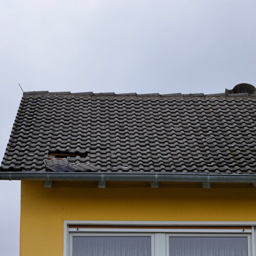 hole left in a roof by a storm