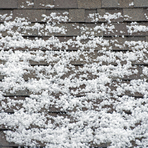 shingle roof covered in hail