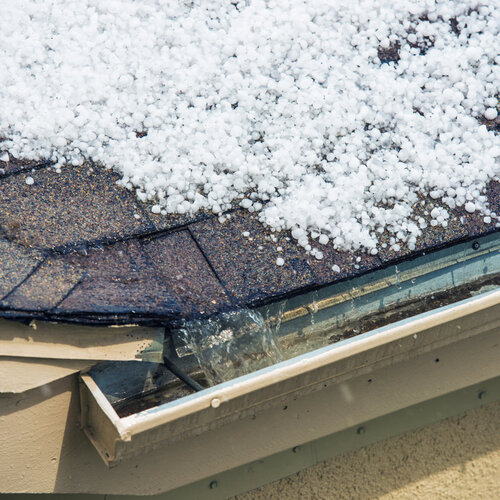 roof covered in melting hailstones