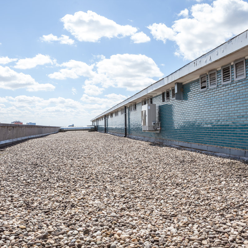 commercial flat roof covered in pebbles