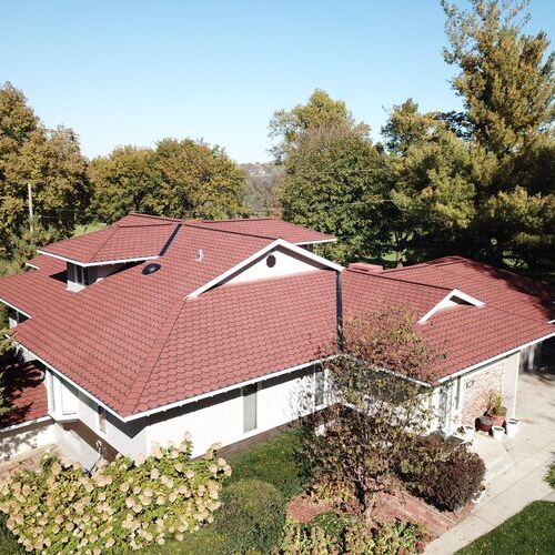 home with a synthetic tile roof