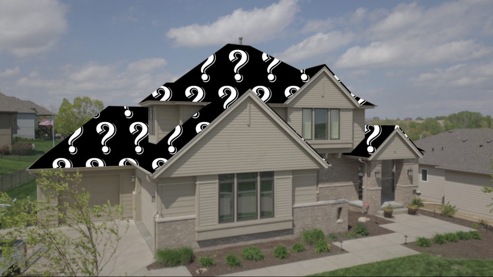 home with a roof covered in question marks