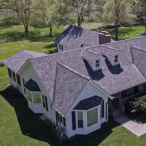 home with an asphalt shingle roofing system