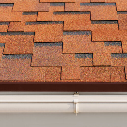 close-up of red asphalt shingle roofing