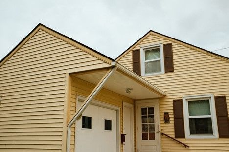 home with yellow vinyl siding