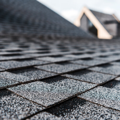 close-up of a roof covered in dark gray shingles