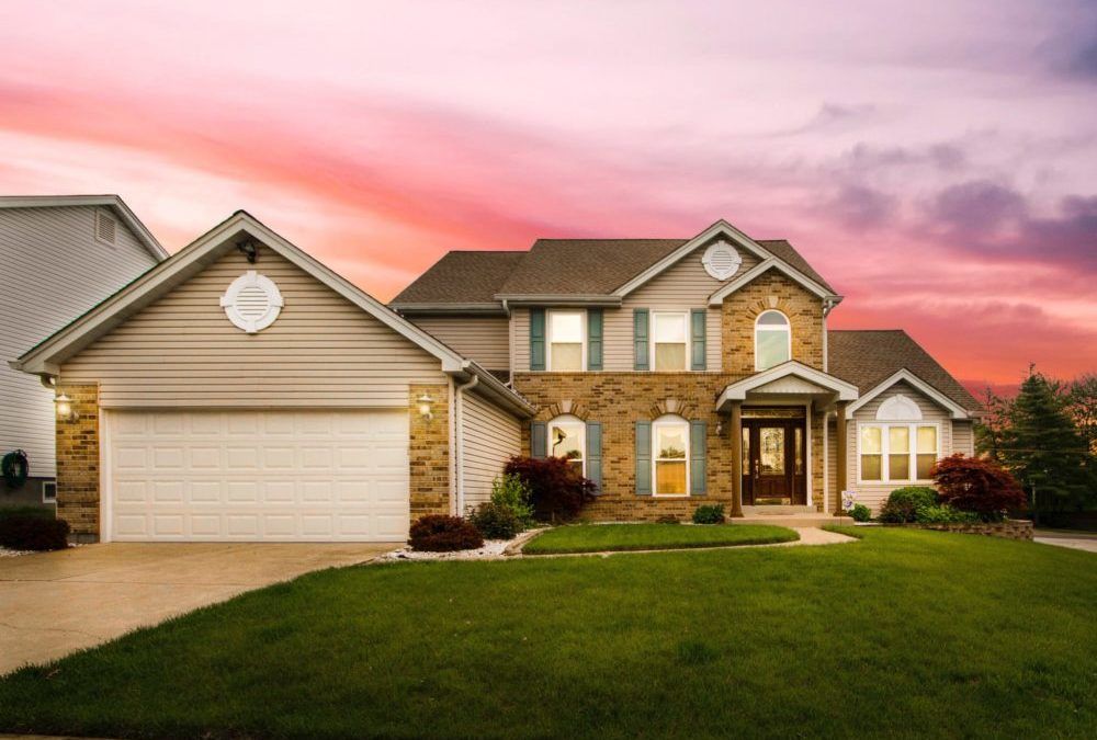 a brick home at sunset