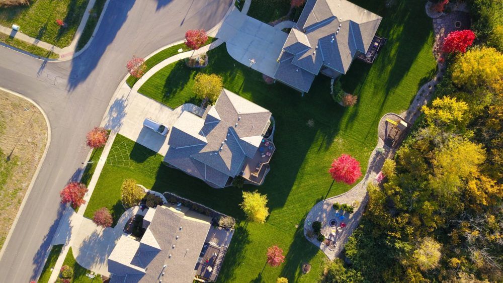 bird's eye view of three houses