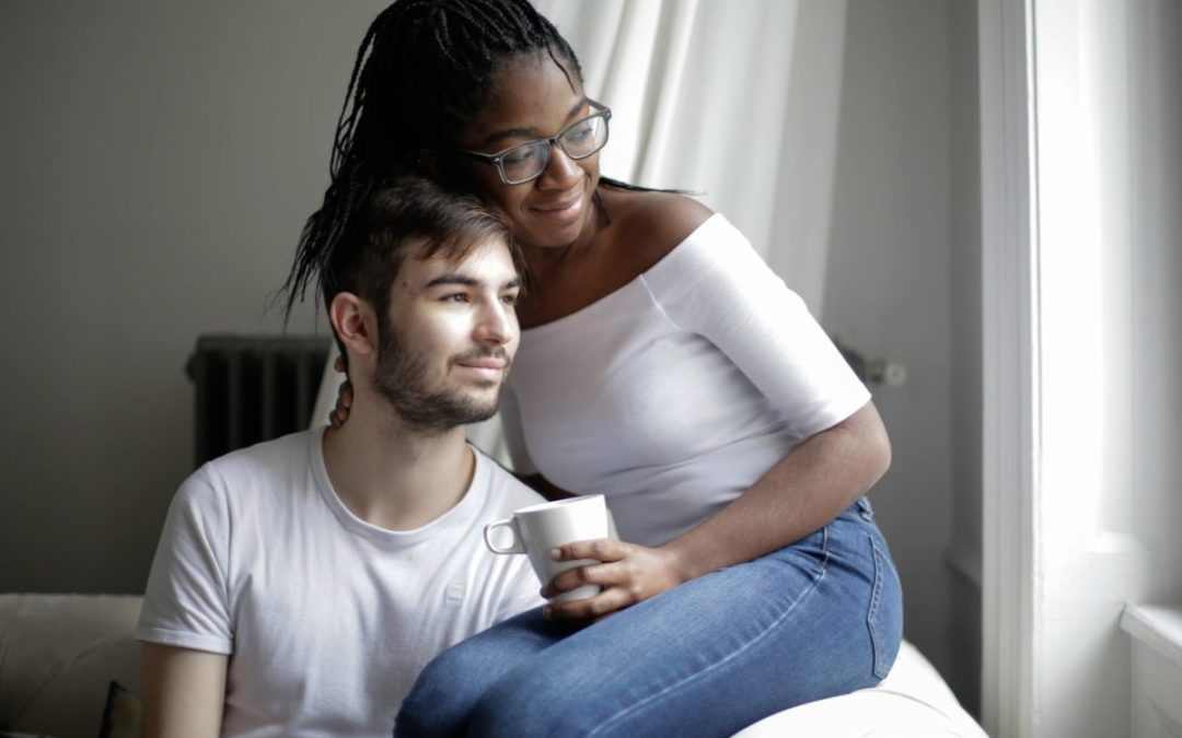 couple sitting inside their new home