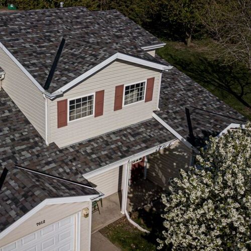 home with a gray asphalt shingle roof