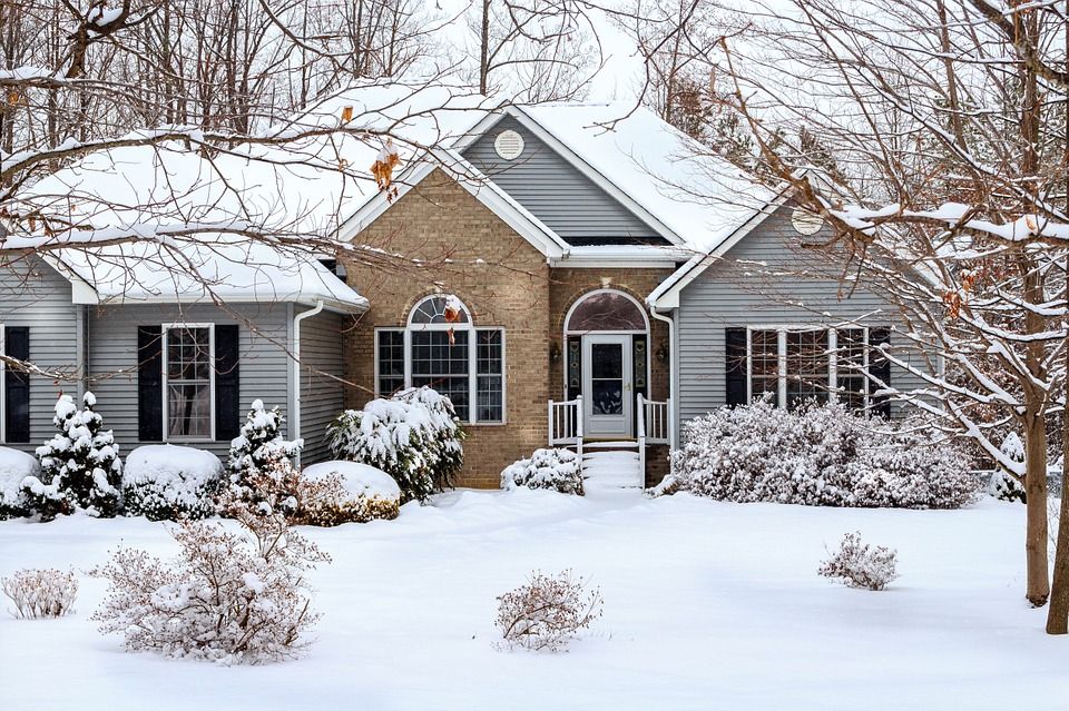 home covered in ice and snow